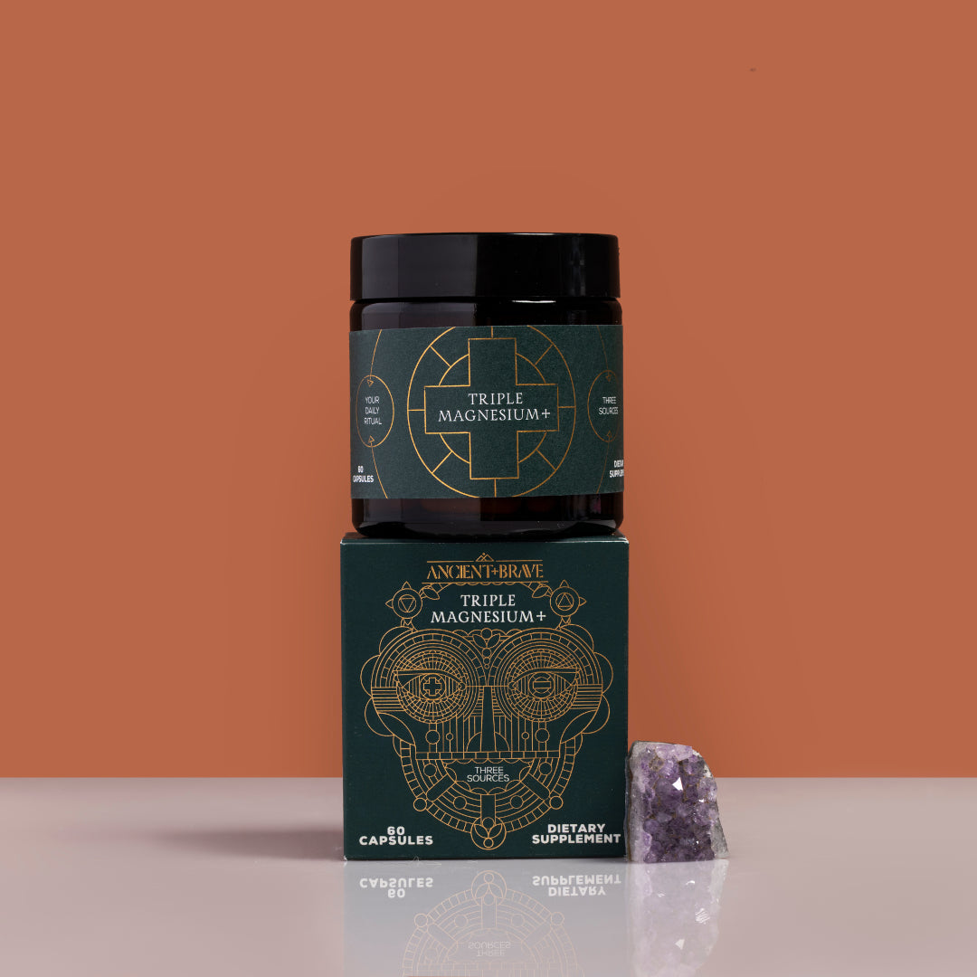 Ancient + Brave | Triple Magnesium+ Capsules | Product Image with Box - placed on matching box with crystal on a warm brown background