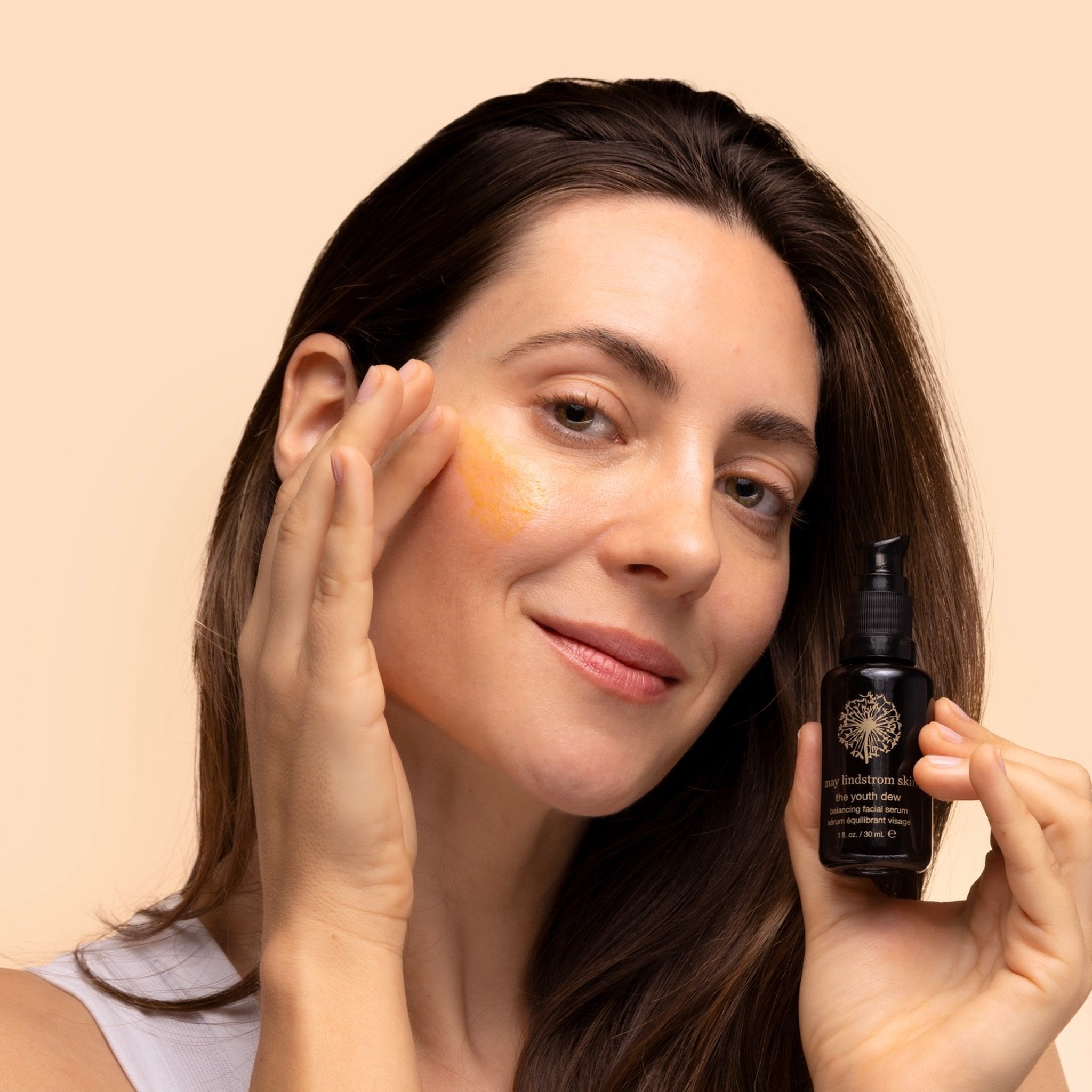 May Lindstrom The Youth Dew - Model applying to skin