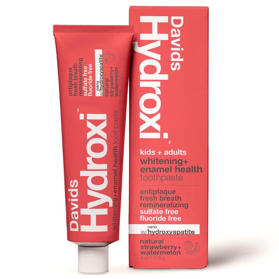 Davids | Hydroxi™ Kids + Adults Toothpaste - Strawberry + Watermelon | Product Image - red tootpaste tube and matching box on a clean white background