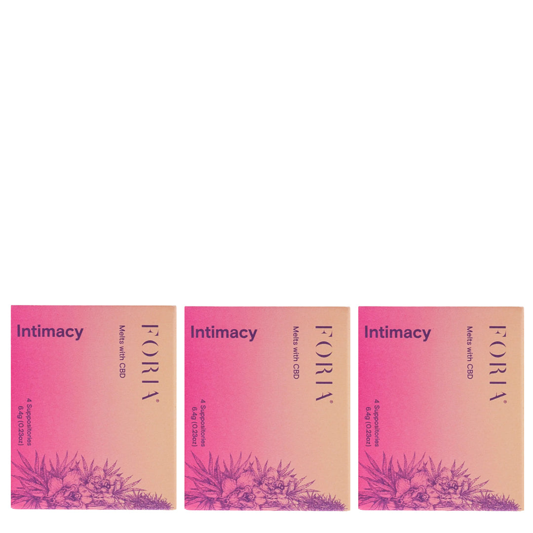 Foria | Intimacy Melts 3 Pack | Product Image - three rectangular boxes featuring a pink-to-peach gradient with dark purple lettering, arranged side by side on a white background