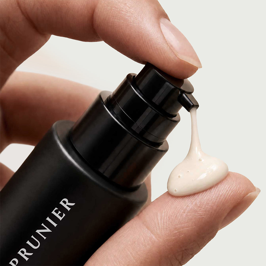 Le Prunier | Plum Helix C Serum | Texture Image - close-up of serum being dispensed onto a fingertip
