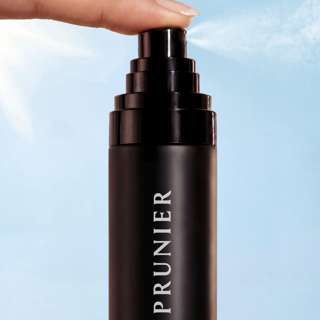Le Prunier | Plum Spritz Dual-Phase Barrier Mist | Product Closeup Image - mist with a fine mist spraying against a blue sky background