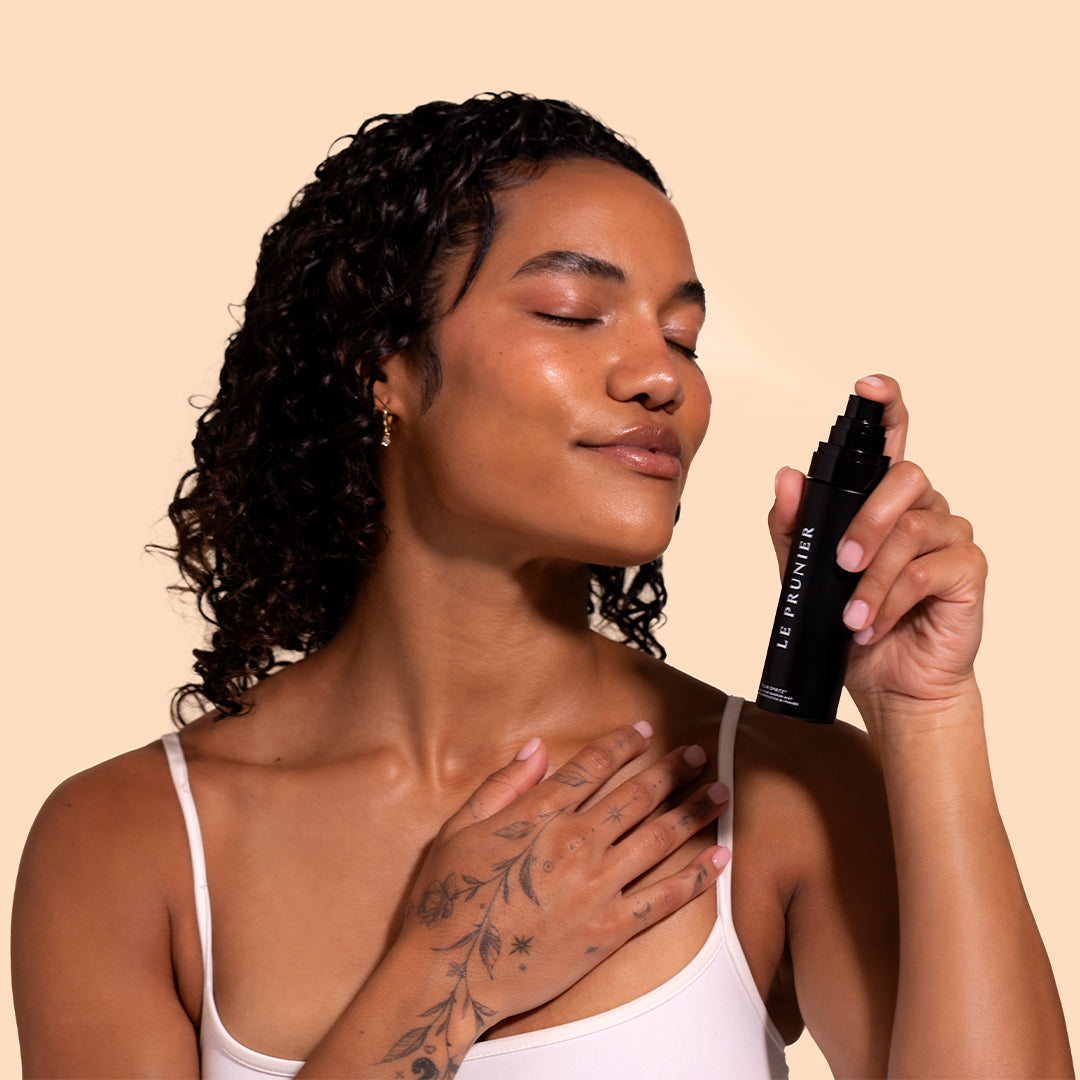 Le Prunier | Plum Spritz | Model Image_Jul26 - model holding and misting facial mist