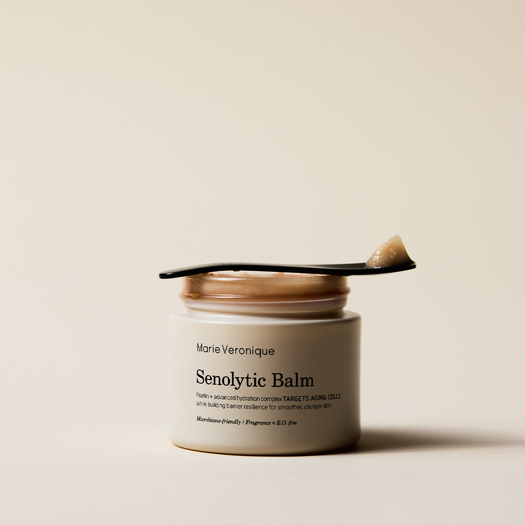 Marie Veronique | Senolytic Balm | Styled Image - open jar with a small spatula resting across the top
