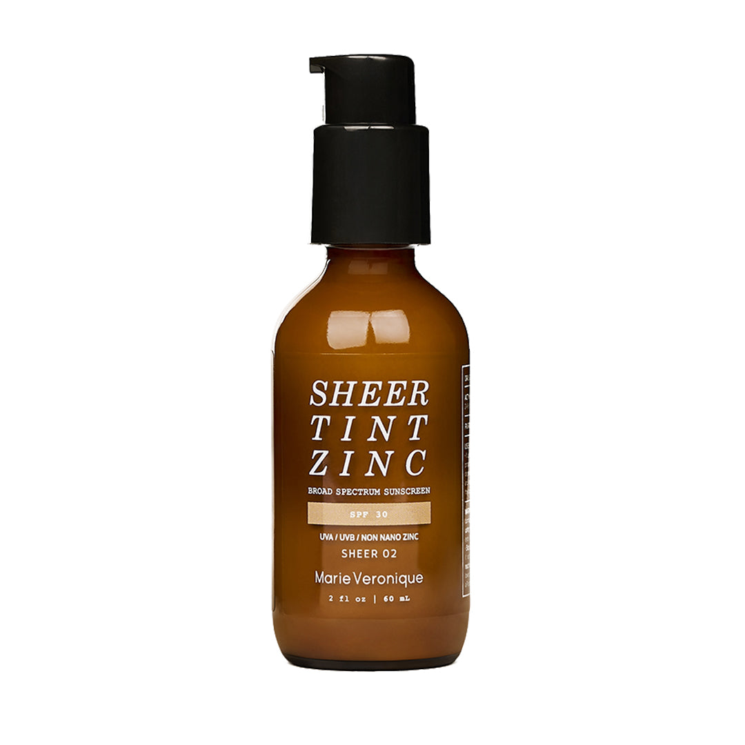 Marie Veronique | Sheer Tint Zinc SPF 30 - Sheer 2 | Product Image - amber brown color with a black pump on white background