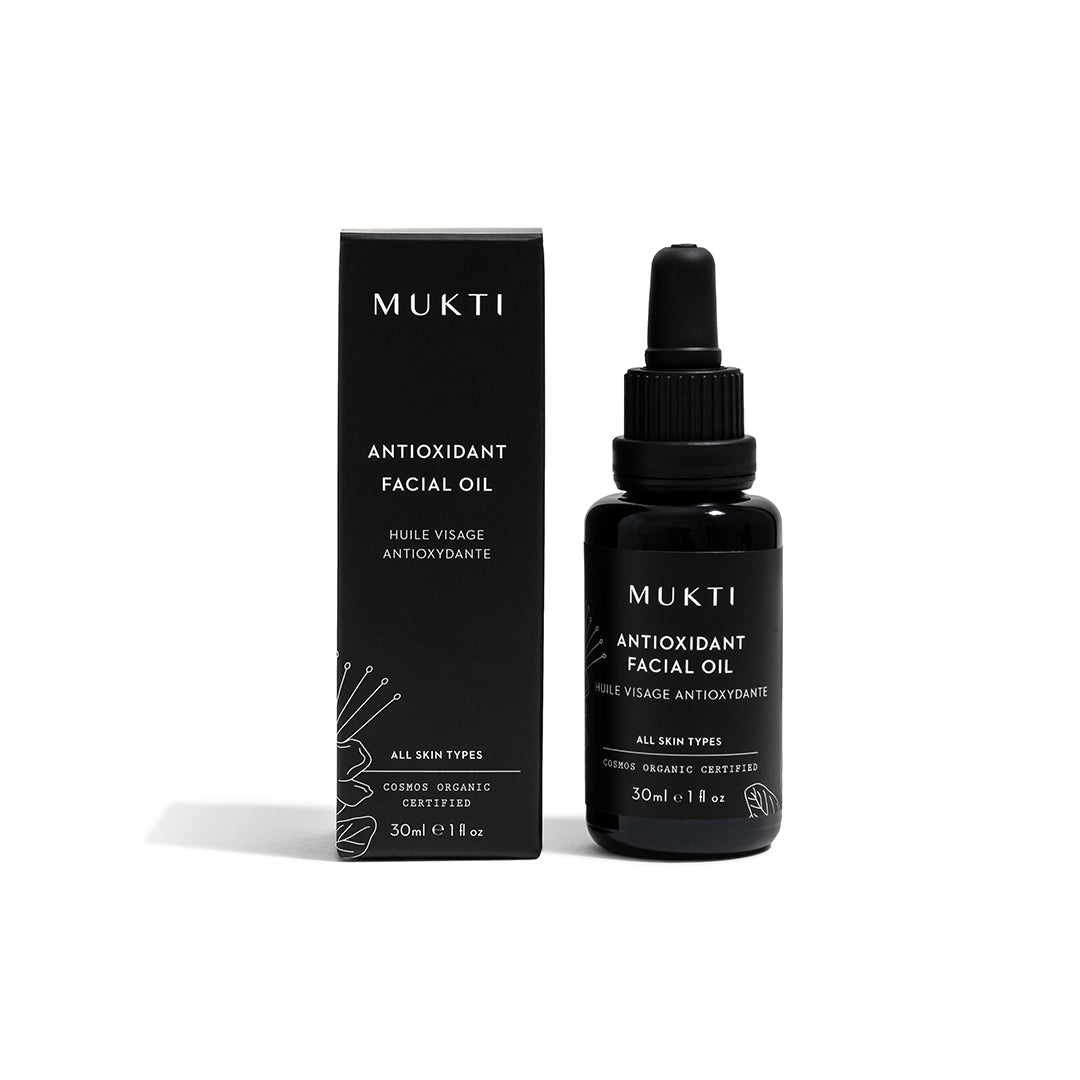 Mukti Organics | Antioxidant Facial Oil | Packaging Image - black dropper bottle with matching black product box on a white background