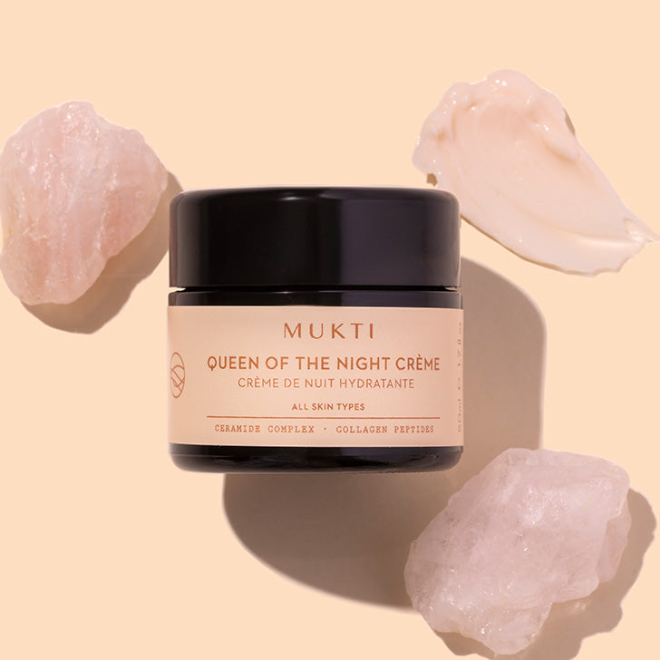 Mukti | Queen of the Night Creme | Styled image with swatch | black jar on peach background with white product swatch
