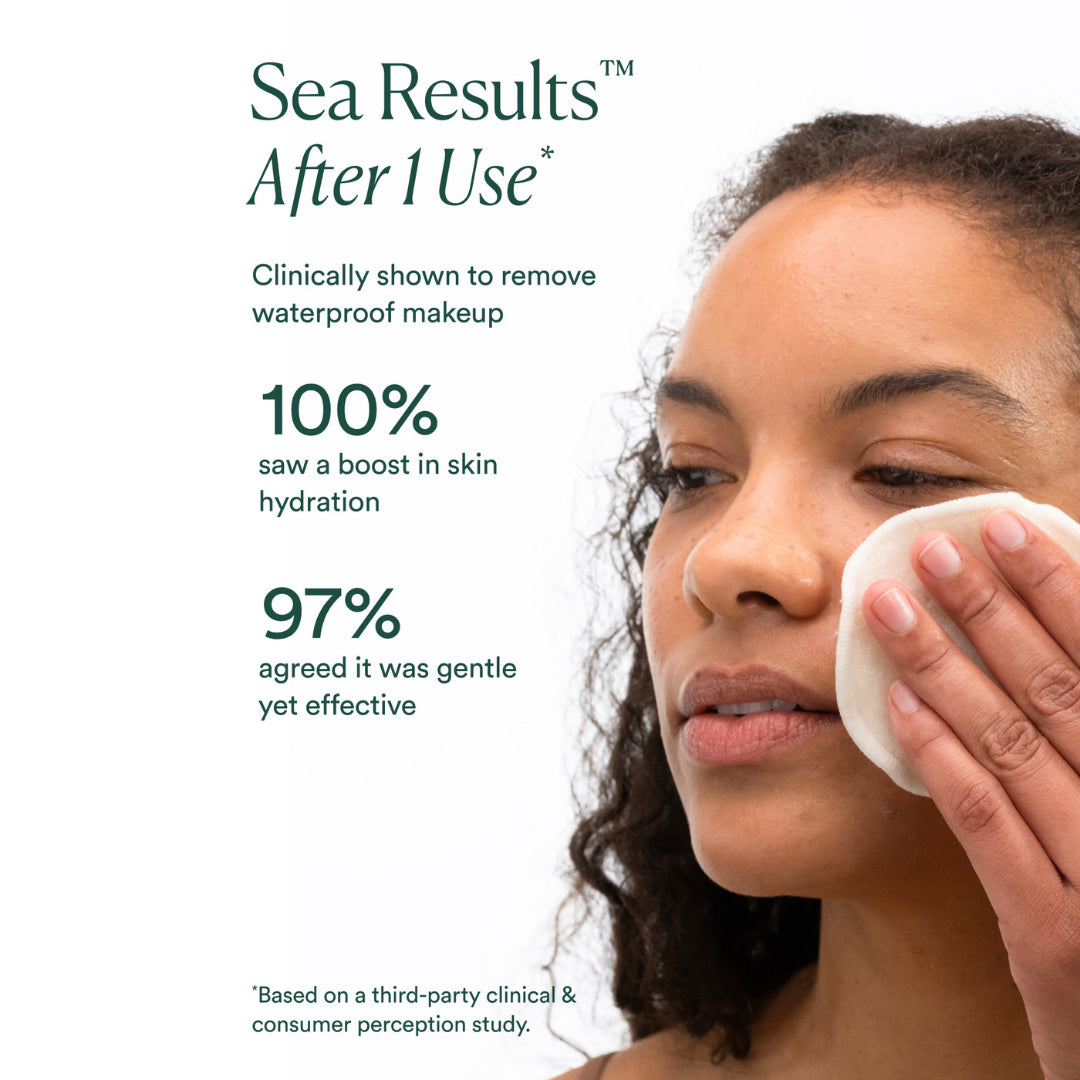 OSEA | Bi Phase Oil Cleanser | Clinical Results Model Image - model using cleansing pad and clinical results text on a white background