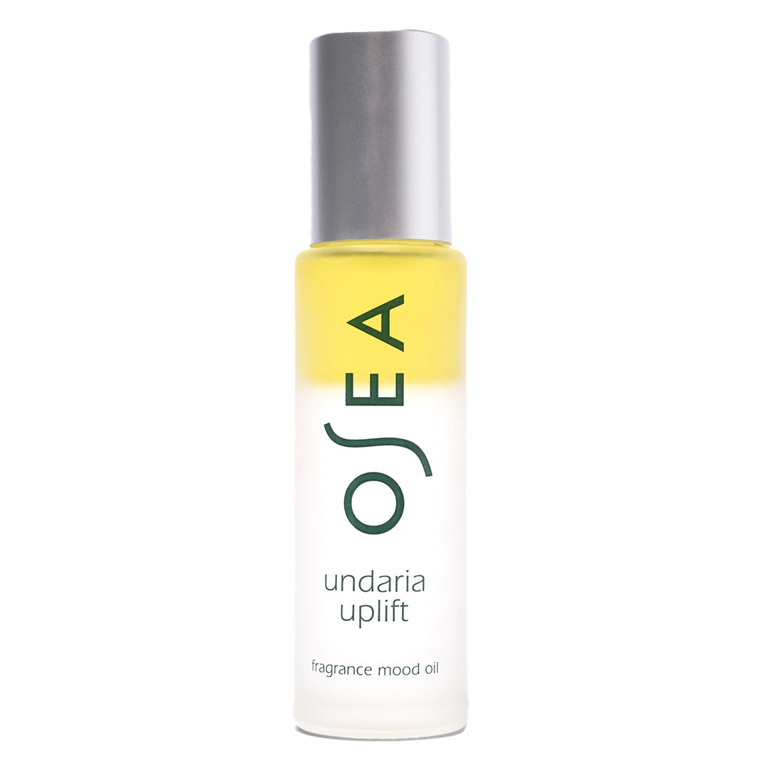 OSEA | Undaria Uplift Fragrance Mood Oil | Product Image - frosted glass rollerball bottle with a silver cap on a light gray background