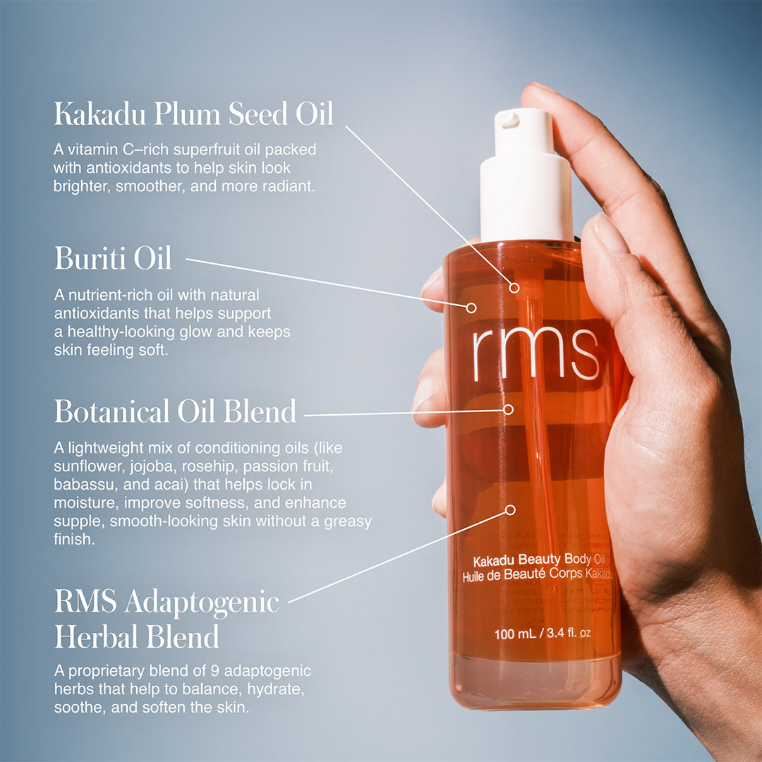 RMS Beauty | Kakadu Body Oil | Ingredient Highlights Image - hand holding bottle with callouts highlighting Kakadu plum seed oil, buriti oil, botanical oil blend, and adaptogenic herbal blend