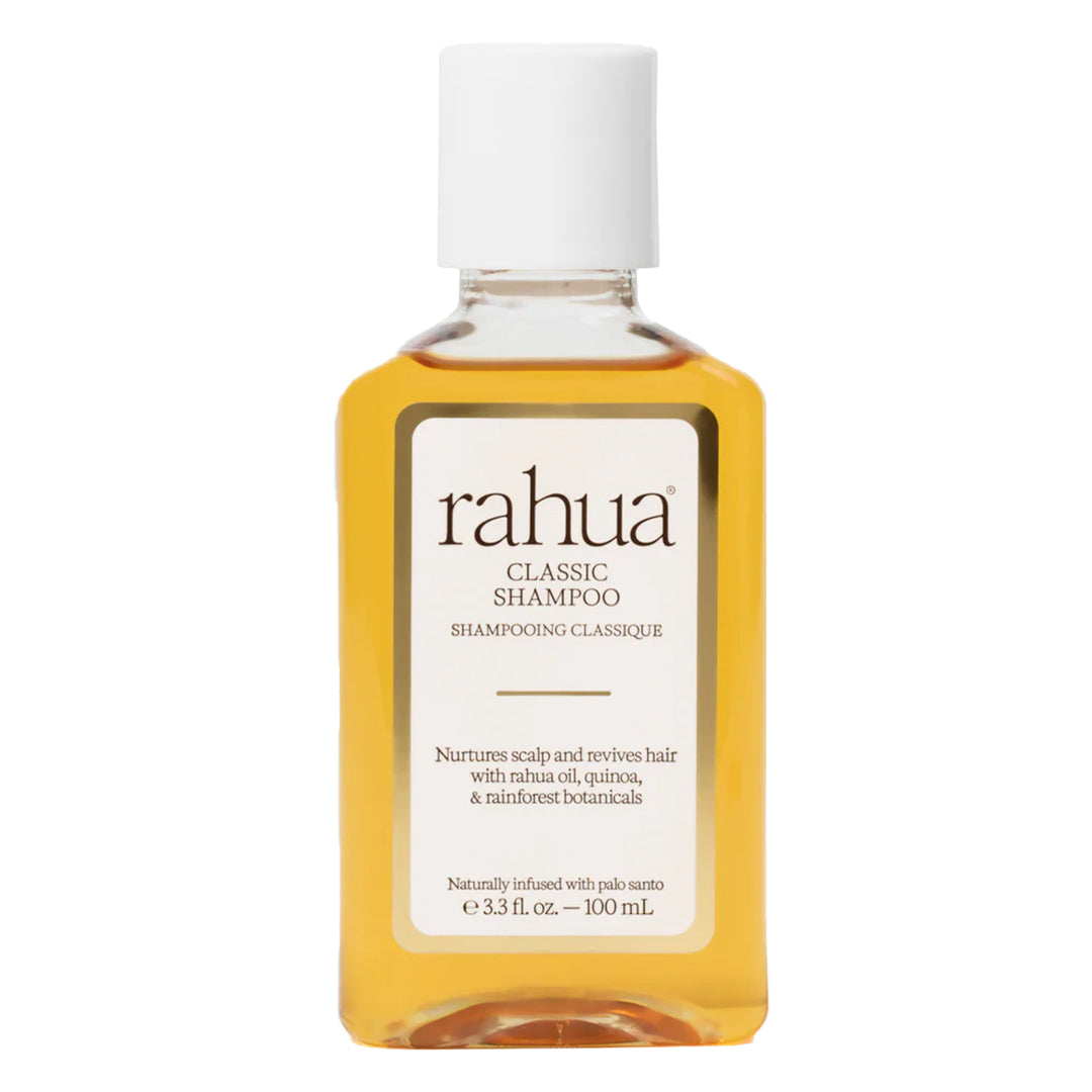 Rahua | Classic Shampoo 100 ml | Product Image - clear bottle filled with golden amber liquid and a white cap on a white background
