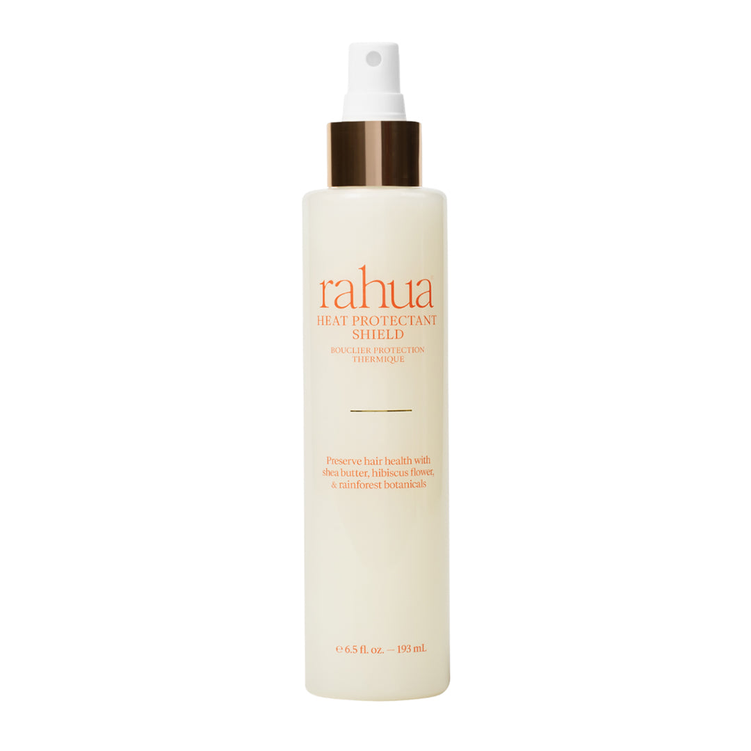 Rahua | Heat Protectant Shield | Product Image - spray bottle with a white mist pump and metallic gold collar, displayed against a white background