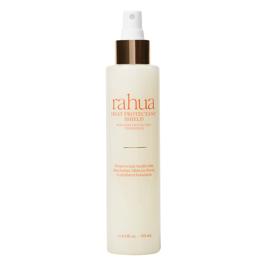 Rahua | Heat Protectant Shield | Product Image - spray bottle with a white mist pump and metallic gold collar, displayed against a white background