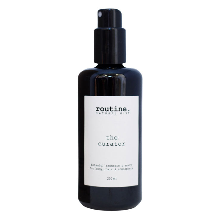 Routine | Body, Hair & Atmosphere Mist - The Curator | Product Image - black glass packaging with white label shown on a white background