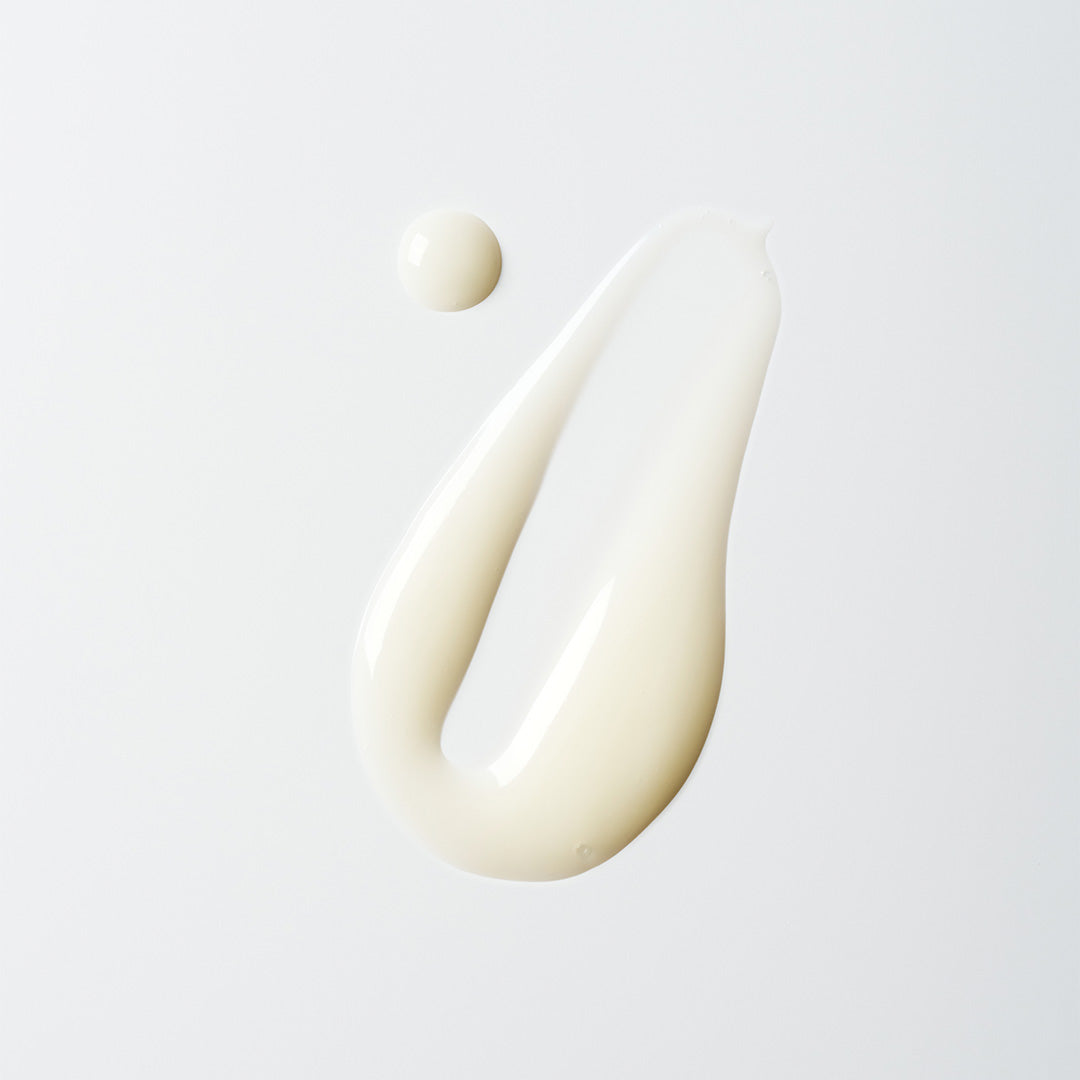 The Root Project | Clean Canvas Detoxifying Hair Cleanser | Swatch Image - creamy white hair cleanser texture swatched on a white background