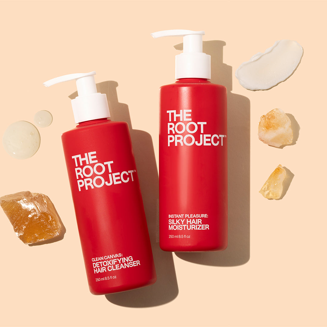 The Root Project | Clean Canvas & Instant Pleasure | Styled Image with Swatch_Oct26 - two red haircare bottles with product swatches and crystal accents against a beige background
