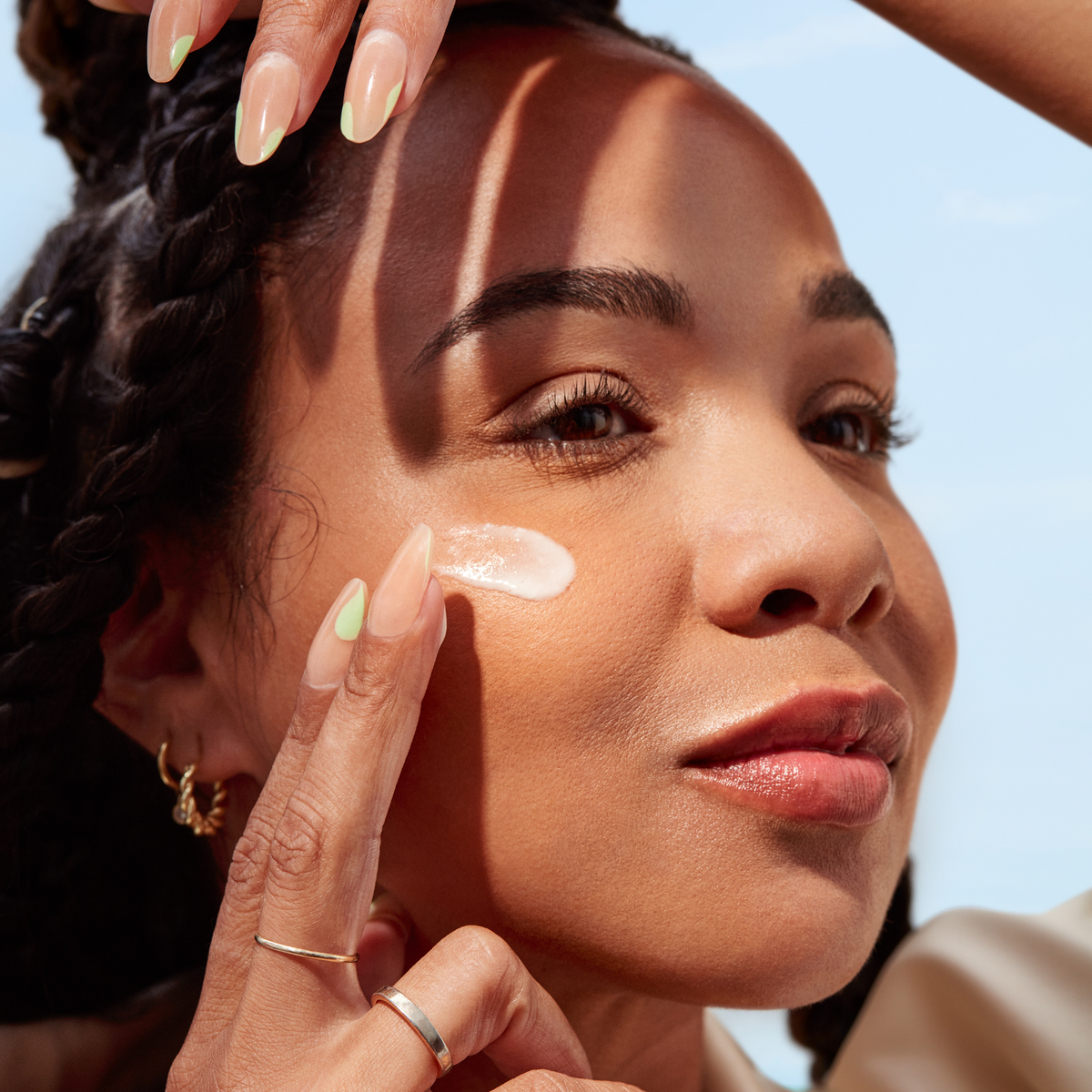 Three Ships | Replenish Barrier Serum | Model Image - person applying serum to cheek