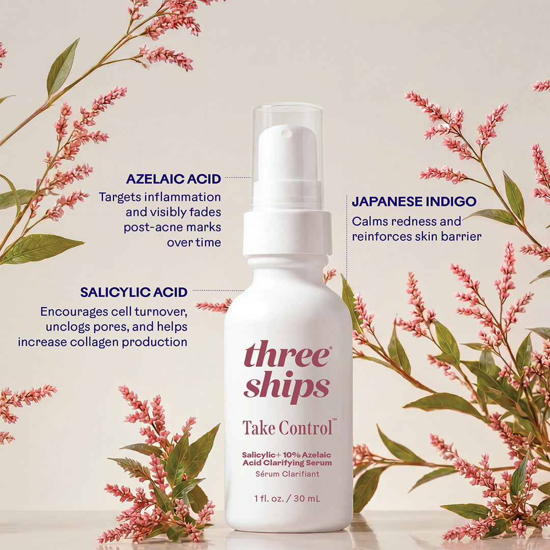 Three Ships | Take Control Salicylic + 10% Azelaic Acid Clarifying Serum | Lifestyle Image - white bottle surrounded by pink flowers on a soft beige background