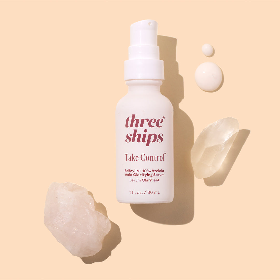 Three Ships | Take Control | Styled Image with Swatch_Sep26 - white bottle with white serum swatches and crystals on a peach background