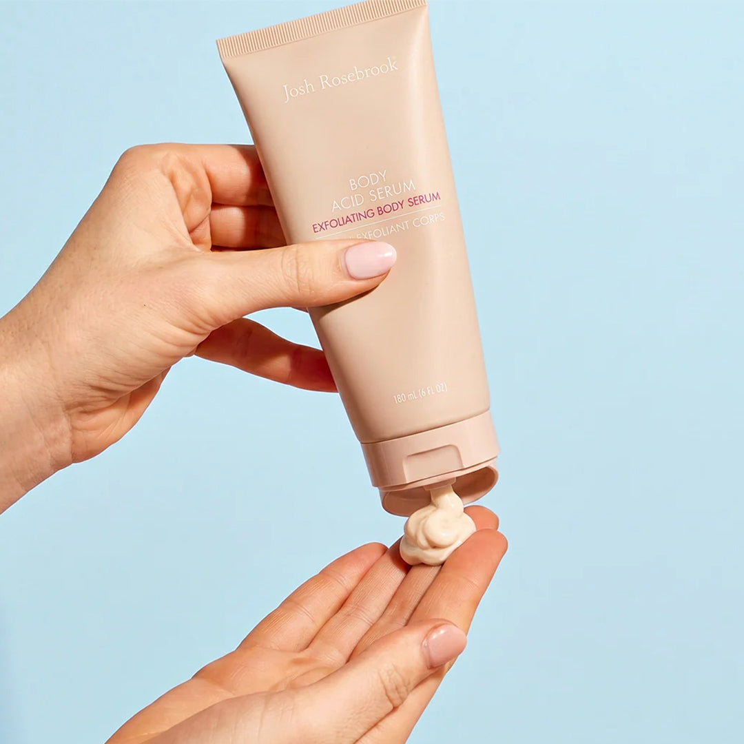 Josh Rosebrook | Body Acid Serum | Texture Image - hands dispensing serum onto an open palm against a blue background