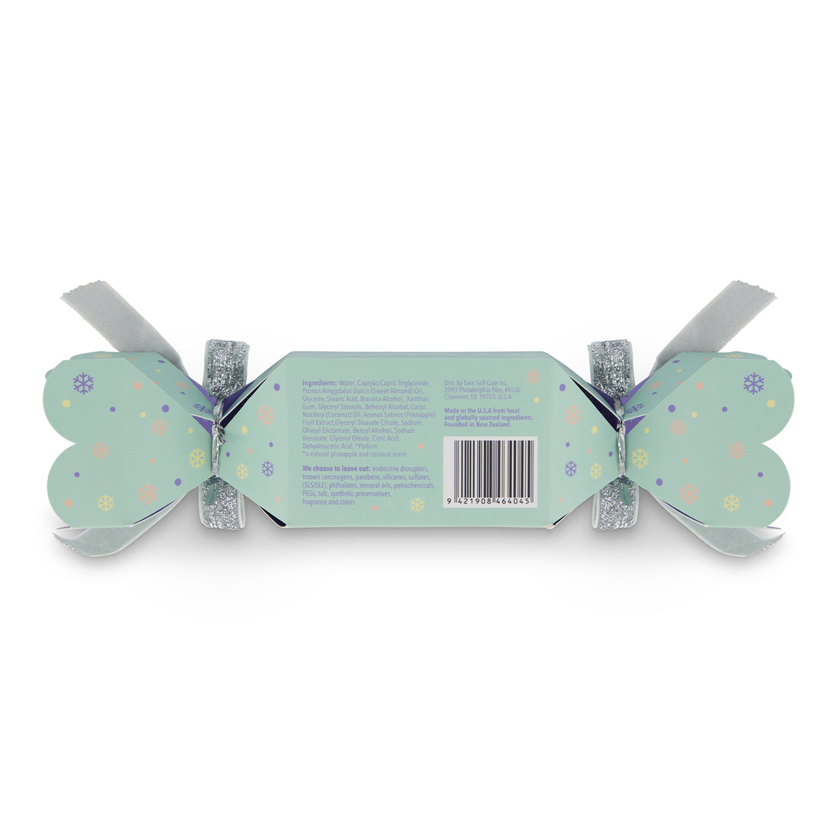 evre. | Oh So Extra Cleanser Xmas Cracker | Back Packaging Image - mint green holiday cracker with pastel snowflake details, silver ribbons, and product information on the back against a white background