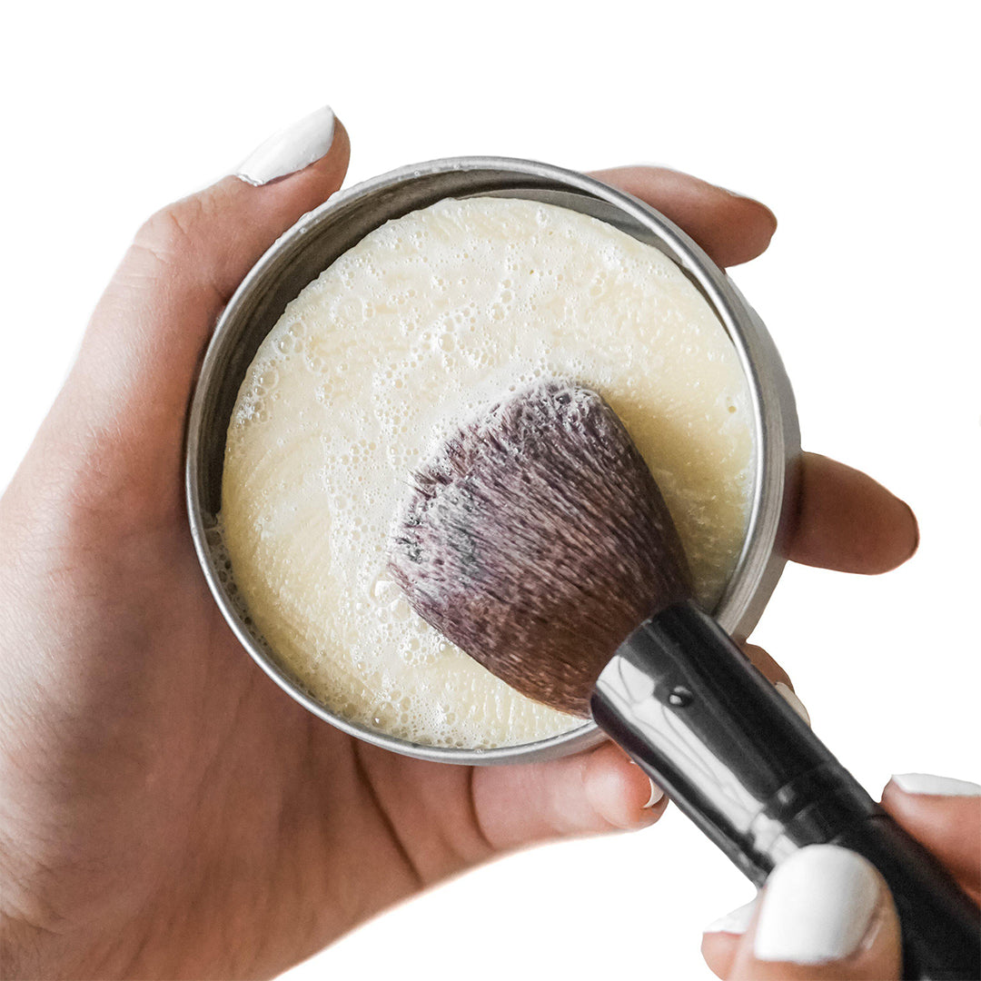 withSimplicity | Brush Cleansing Balm | Lifestyle Image - makeup brush lathering in cleansing balm