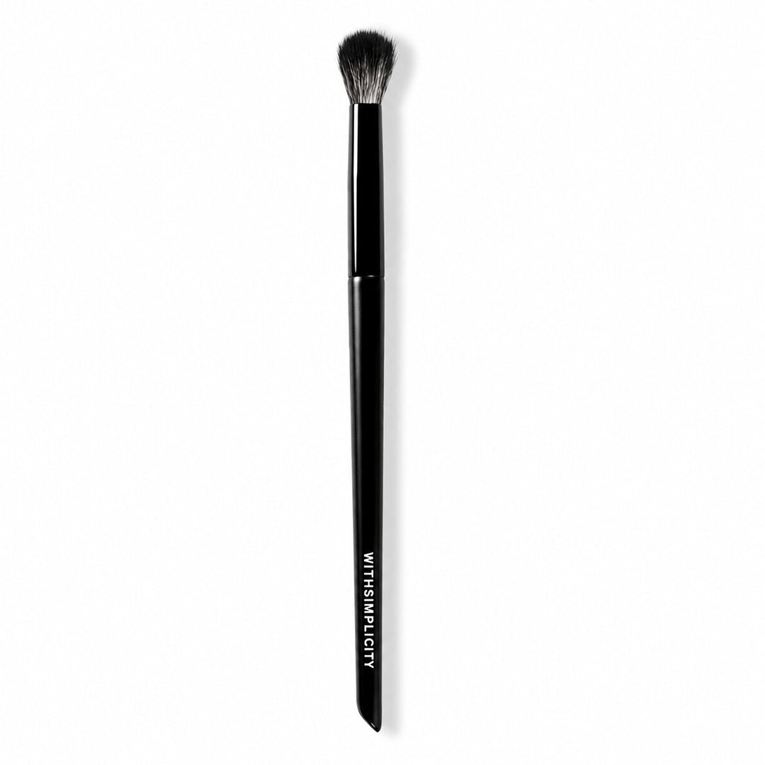 withSimplicity | Eye Blender Brush | Product Image - eye blender brush with fluffy black bristles and a slim black handle on a white background