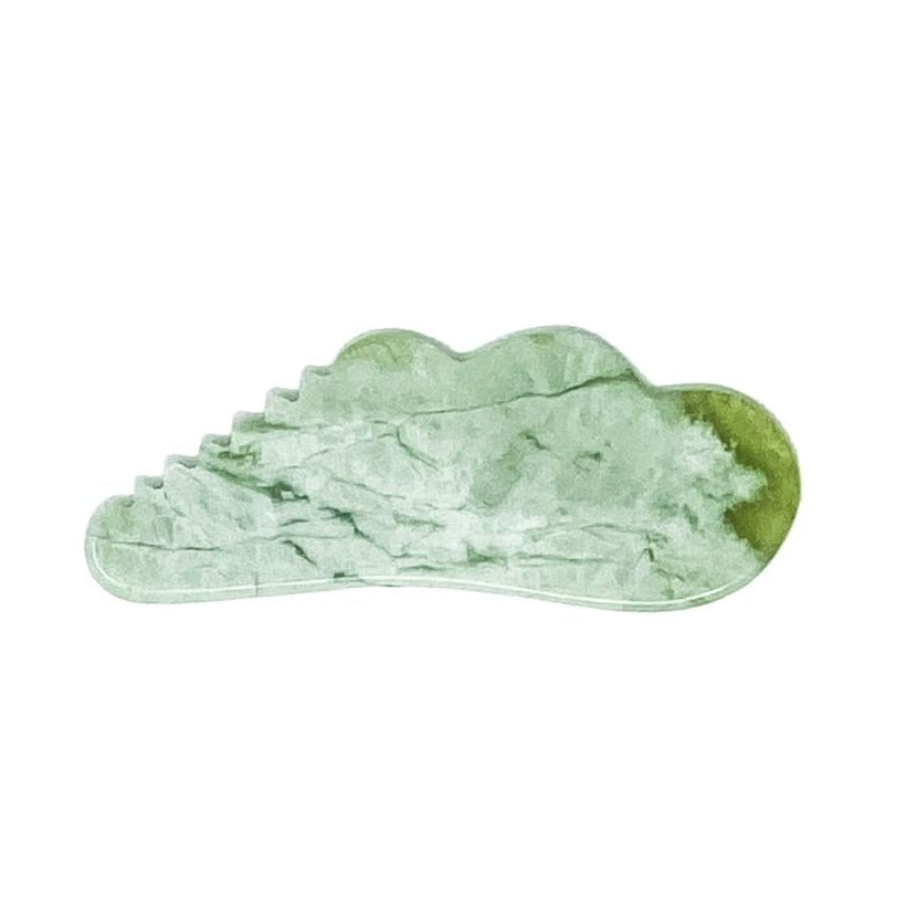 Cecily Braden | Pocket Jade Gua Sha | A light green jade-like gua sha massage tool with a natural marbled texture, shown on a plain white background.