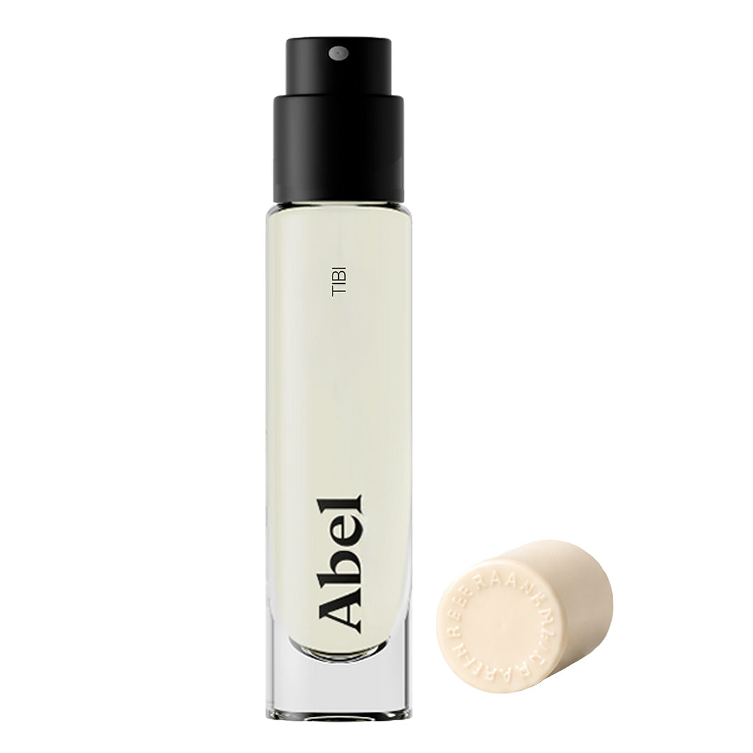 Abel | Tibi 6 ml | Product Image - frosted travel-size clear glass spray bottle with a black sprayer and cream cap on a white background
