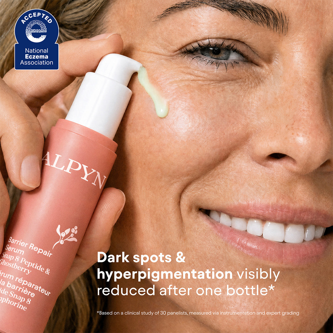 Alpyn Beauty | Barrier Repair Serum | Model Image - serum being applied to the cheek with a green texture