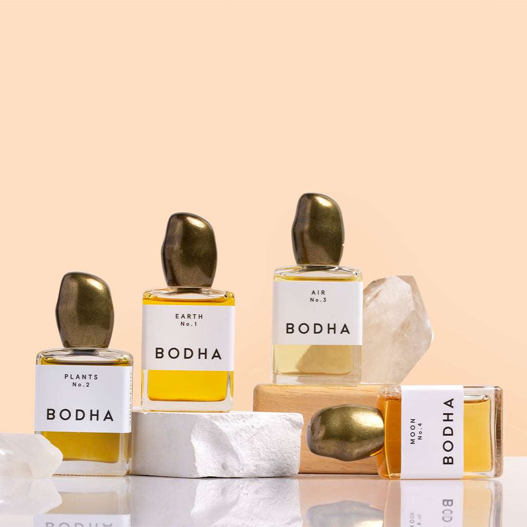 BODHA | Perfume Oils | Styled Image_Oct26 - Earth No. 1 perfume oil on a stone block beside a crystal