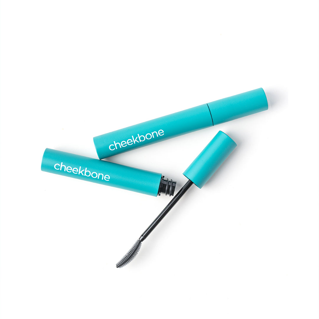 Cheekbone Beauty | Uprise Mascara | Product Image2 - tubes with open wand displayed on a light gray background