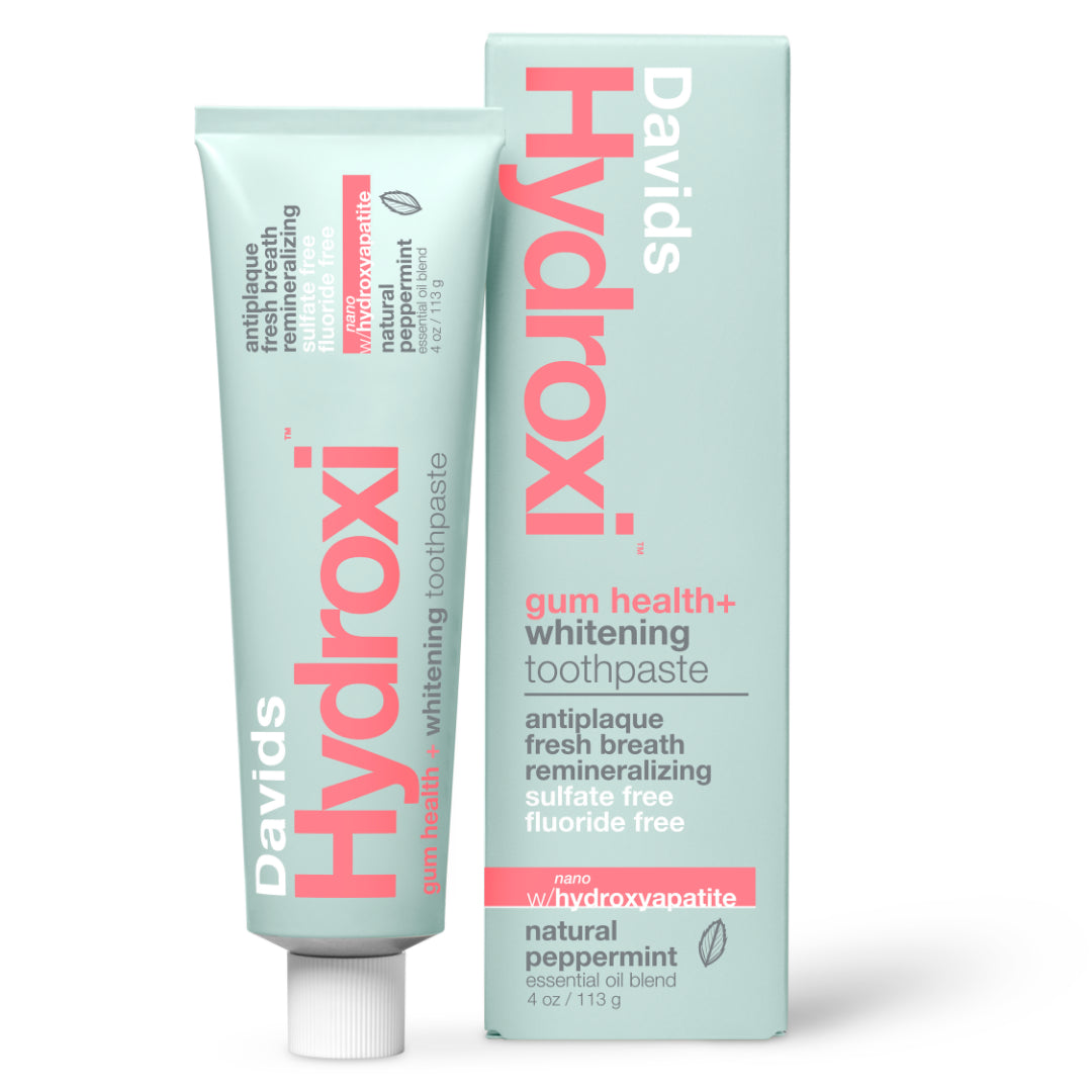 Davids | Hydroxi™ Gum Health + Whitening Nano Toothpaste - Peppermint | Tube and Box Image - mint green toothpaste tube displayed alongside its matching packaging on a white background