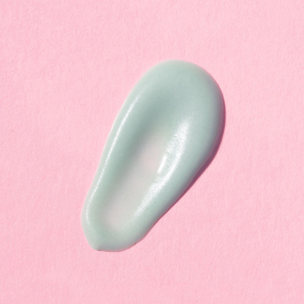 Earth Harbor | Aqua Aura Peptide Awaken Eye Cream | Swatch Image - pale green swatch on a pink background