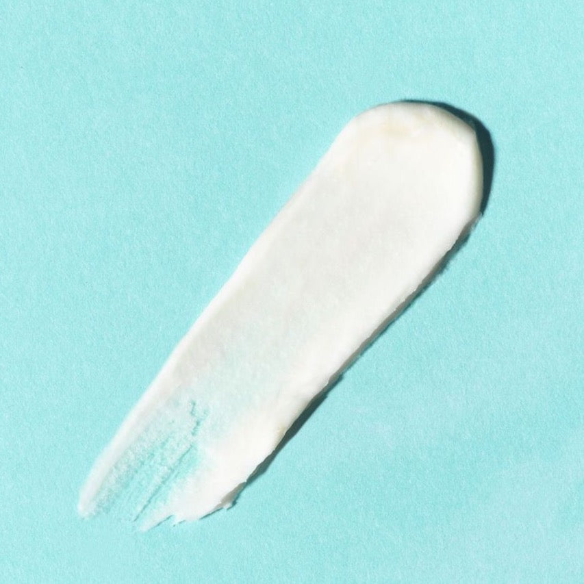 Earth Harbor | Siren Silk Bio-Retinol Hydration Cream | Texture Image - swatch of white cream on a turquoise background