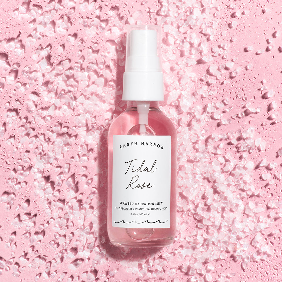 Earth Harbor | Tidal Rose Seaweed Hydration Mist | Lifestyle Image2 - mist bottle surrounded by pink crystals on a pink background