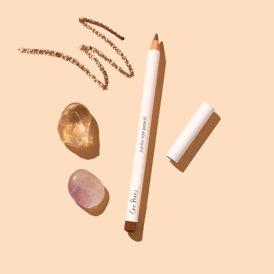 Ere Perez | Jojoba Eye Pencil in shade Clay | Product Flat Lay on beige background with product scribble