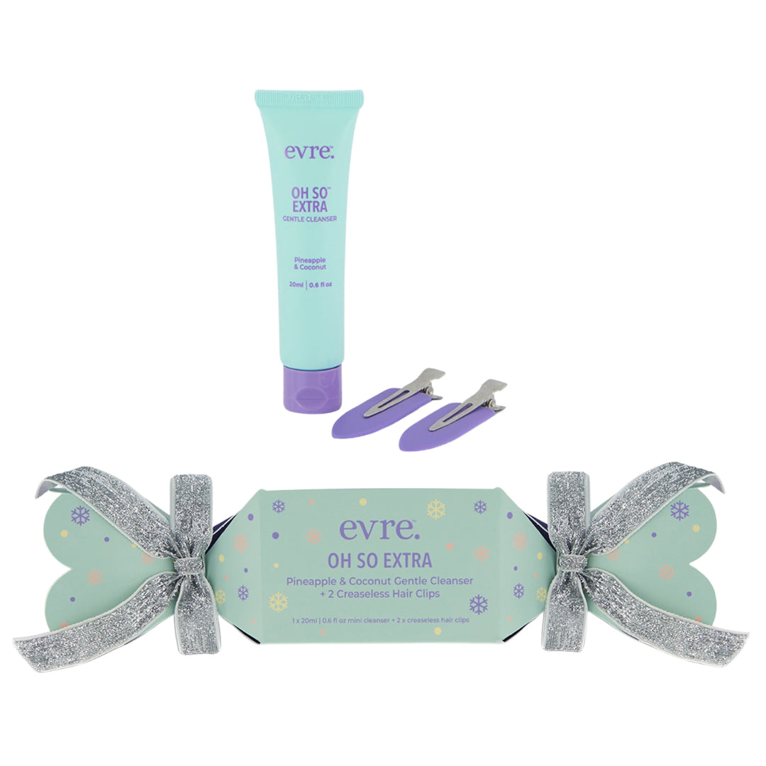 Evre | Oh So Extra Gentle Cleanser + 2 Creaseless Hair Clips | Product Image - green tube cleanser, two purple hair clips, and festive cracker packaging on a white background
