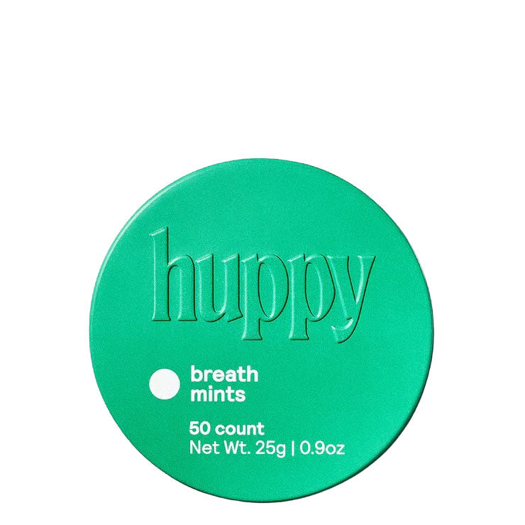 Green container of 'huppy' breath mints on a white background