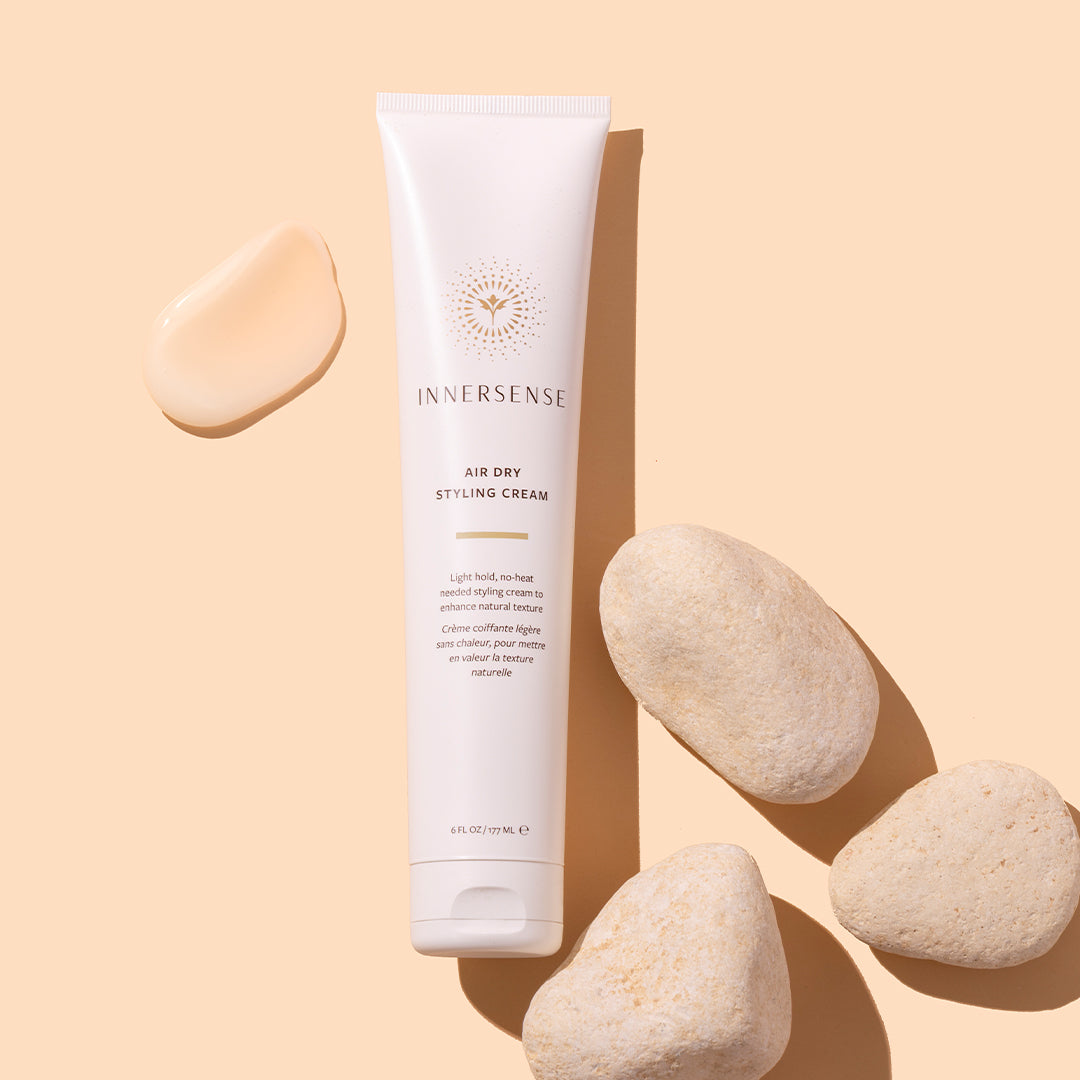 Innersense Organic Beauty | Air Dry Styling Cream | Product Image with Swatch - white tube on a beige background.