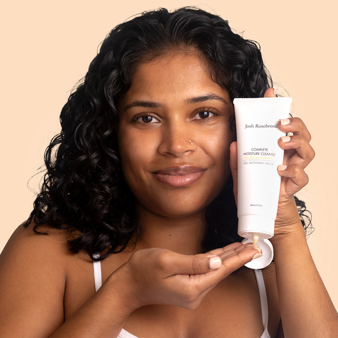 Josh Rosebrook | Complete Moisture Cleanse | Model Image - person holding cleanser tube while dispensing gel cleanser into hand