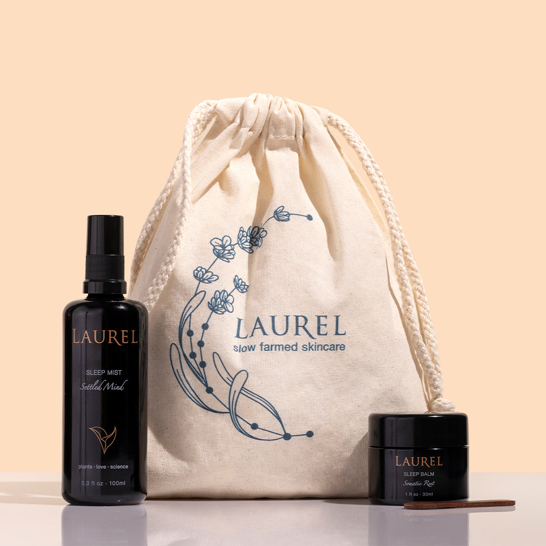 Laurel Skin | Sleep Set | Styled Image_Oct26 - sleep set with Sleep Mist, Sleep Balm, and drawstring bag on a peach background