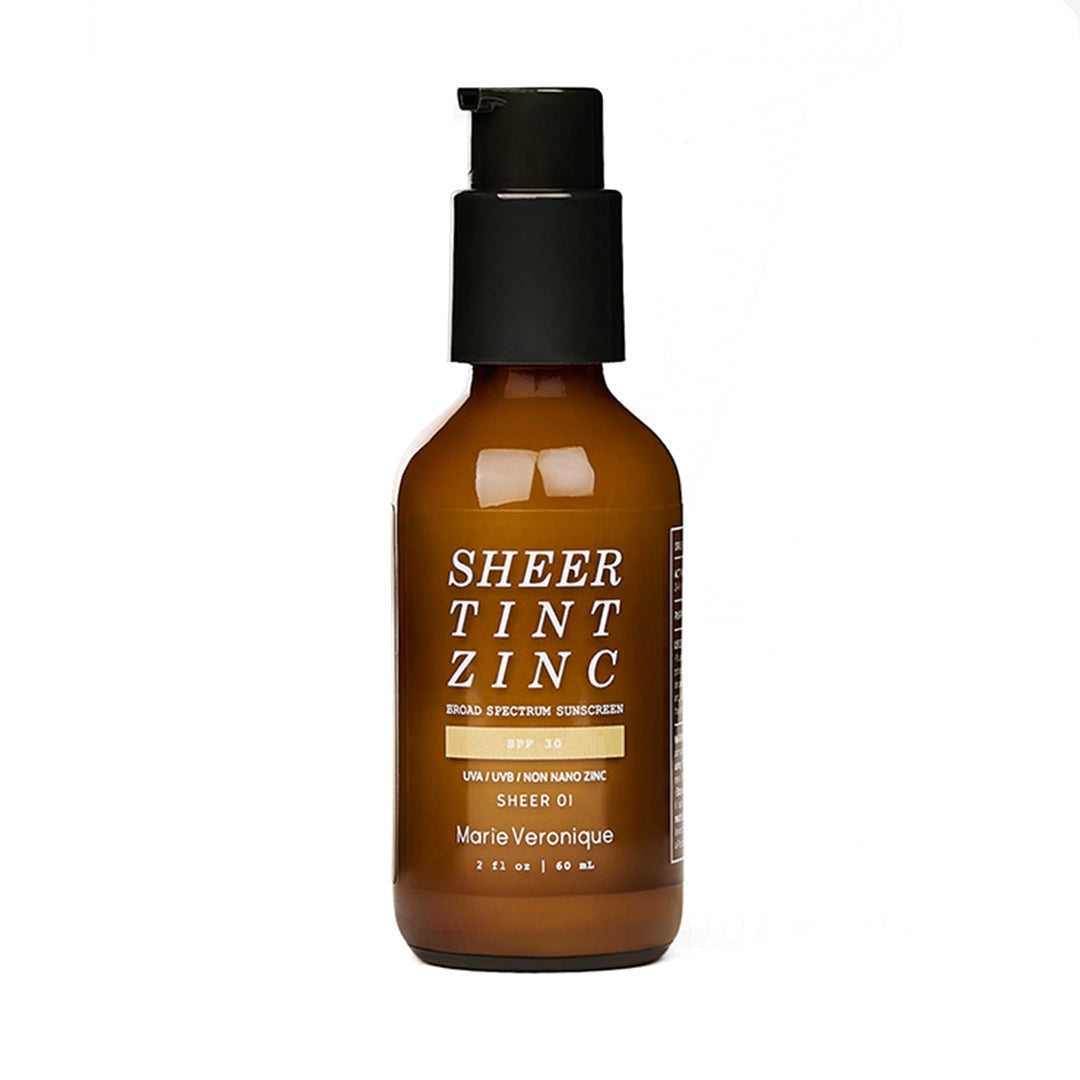 Marie Veronique | Sheer Tint Zinc SPF 30 - Sheer 1 | Product Image - amber brown color with a black pump on white background