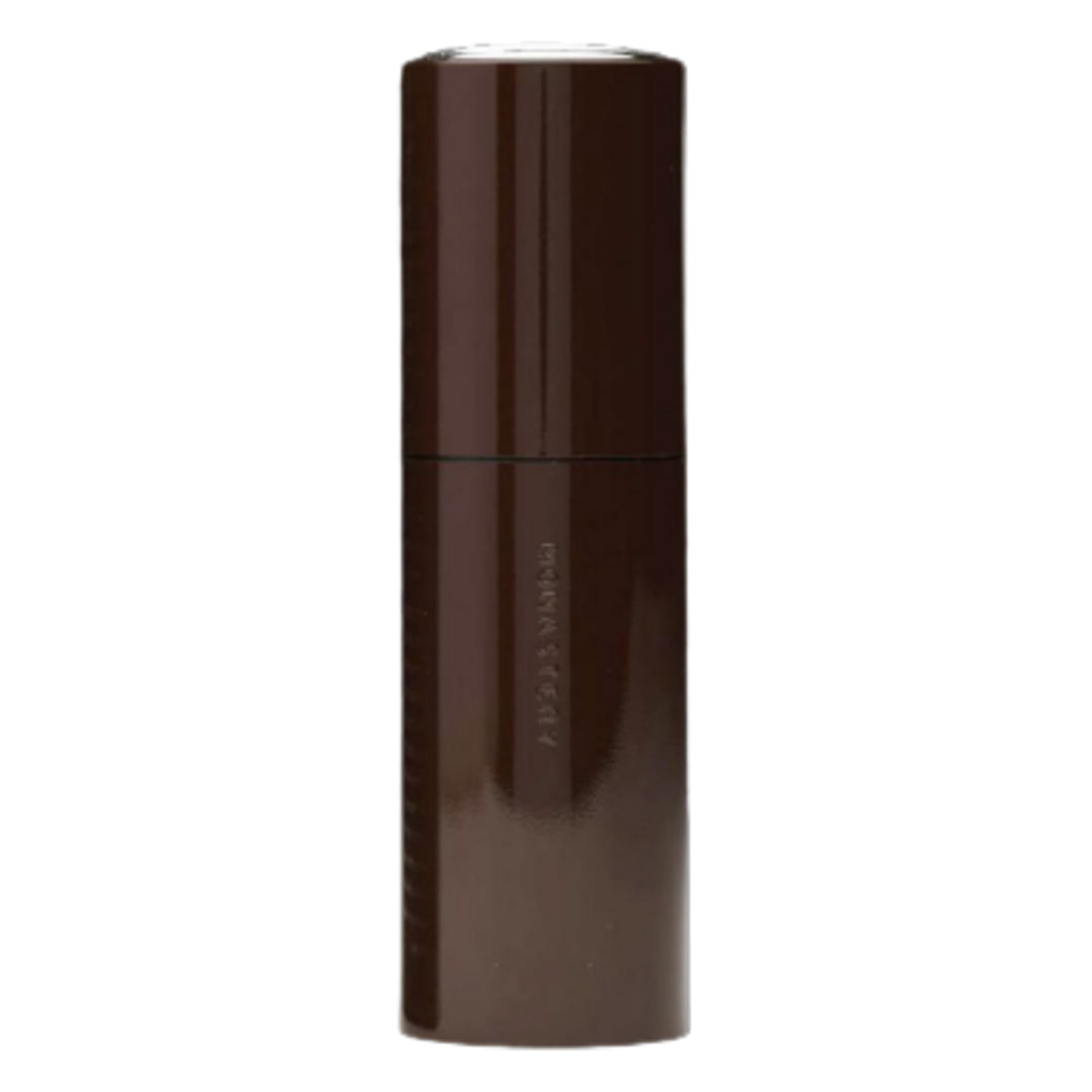 Monastery | Flora Botanical Cream Serum | Primary Image - tall, dark brown cylindrical bottle on a white background