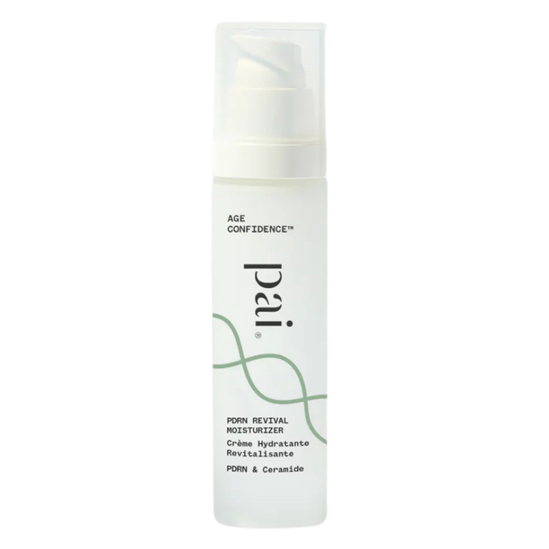 Pai Skincare | Age Confidence PDRN Revival Moisturizer | Product Image - white pump bottle with a translucent cap, black lettering, and a green wave design on a white background