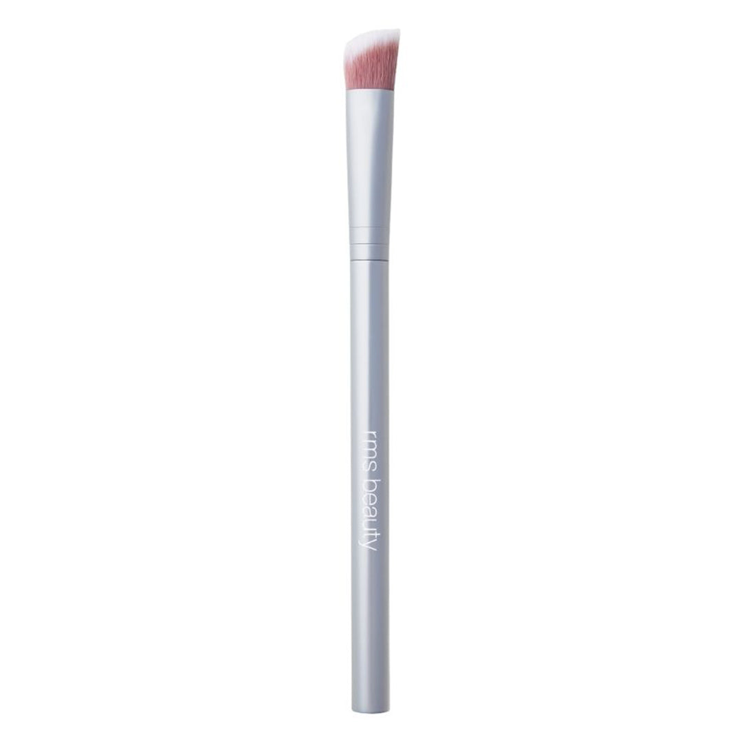 RMS Beauty | Concealer Brush | Product Image - brush with soft pink-and-white angled synthetic bristles and a matte silver handle on a white background