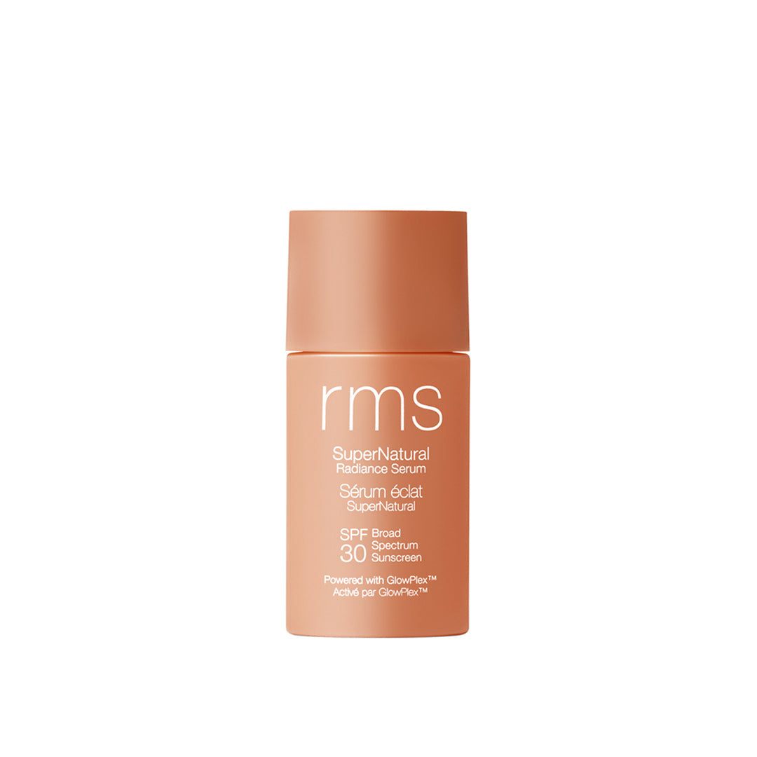 RMS Beauty | SuperNatural Radiance Serum Broad Spectrum SPF 30 Sunscreen | Medium Aura Shade Product Image - warm tan bottle on a white background