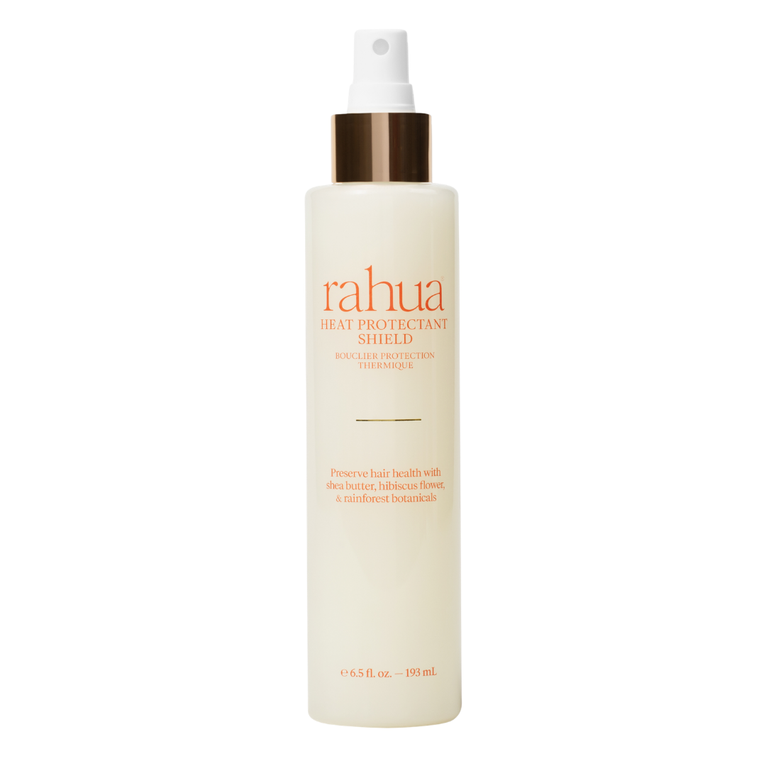 Rahua | Heat Protectant Shield | Product Image - spray bottle with a white mist pump and metallic gold collar, displayed against a white background