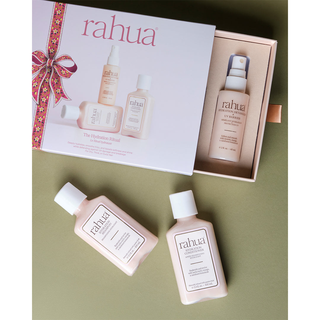 Rahua | The Hydration Ritual | Open Gift Set - open haircare gift box with three travel-size products arranged on an olive green background