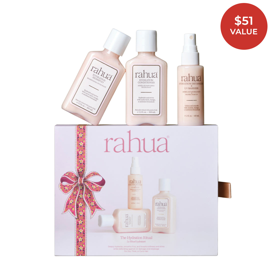 Rahua | The Hydration Ritual | Product Image - three travel-size haircare products displayed above a decorative gift box